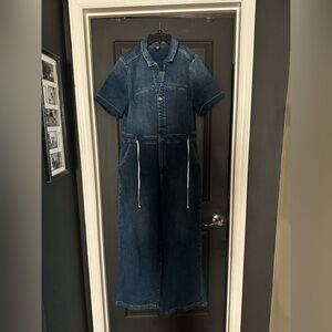 Ladies blue jean jumpsuit. Short sleeved with string tie around waist
